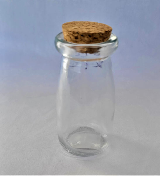 <span style='position: fixed;top: 500px;left: calc( 550px + (100vw - 600px)/2);'></span>
<table width='100%' border='0'>
  <tr>
    <td style='padding: 5px;width: 70%;background-color:#ec0d0d;vertical-align: middle;font-size:35px;height: 102px;border-radius: 20px;'>Glass Jar with Cork Lid /1</td>
    <td class='watch' align='center' style='position: fixed; background-image:url(assets/price.png);background-size: cover;
    font-size: 45px;
    top: 645px;
    left: calc( 460px + (100vw - 600px)/2);
    width: 245px;
    height: 200px;
    text-align: -webkit-center;
    vertical-align: middle;'><div style='padding-top: 90px;transform: rotate(7deg);'><span>8.00  R</span></div></td>    
  </tr>
</table>